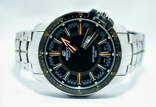 A close-up studio shot of a stainless steel Casio Edifice watch with a black dial