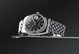 Rolex-style stainless steel watch with jubilee bracelet showing surfaces to clean at home safely