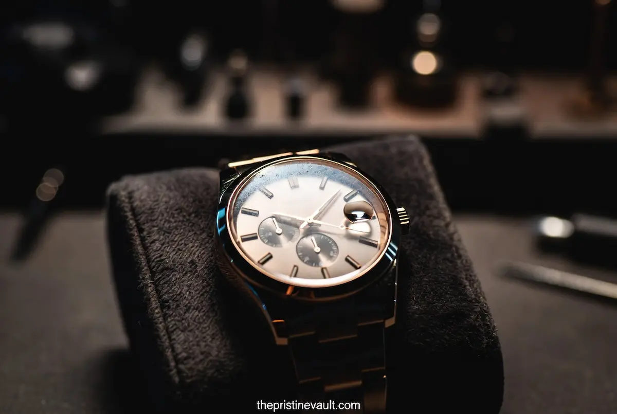 A luxury automatic watch showing signs of moisture under the crystal, indicating it needs professional servicing.