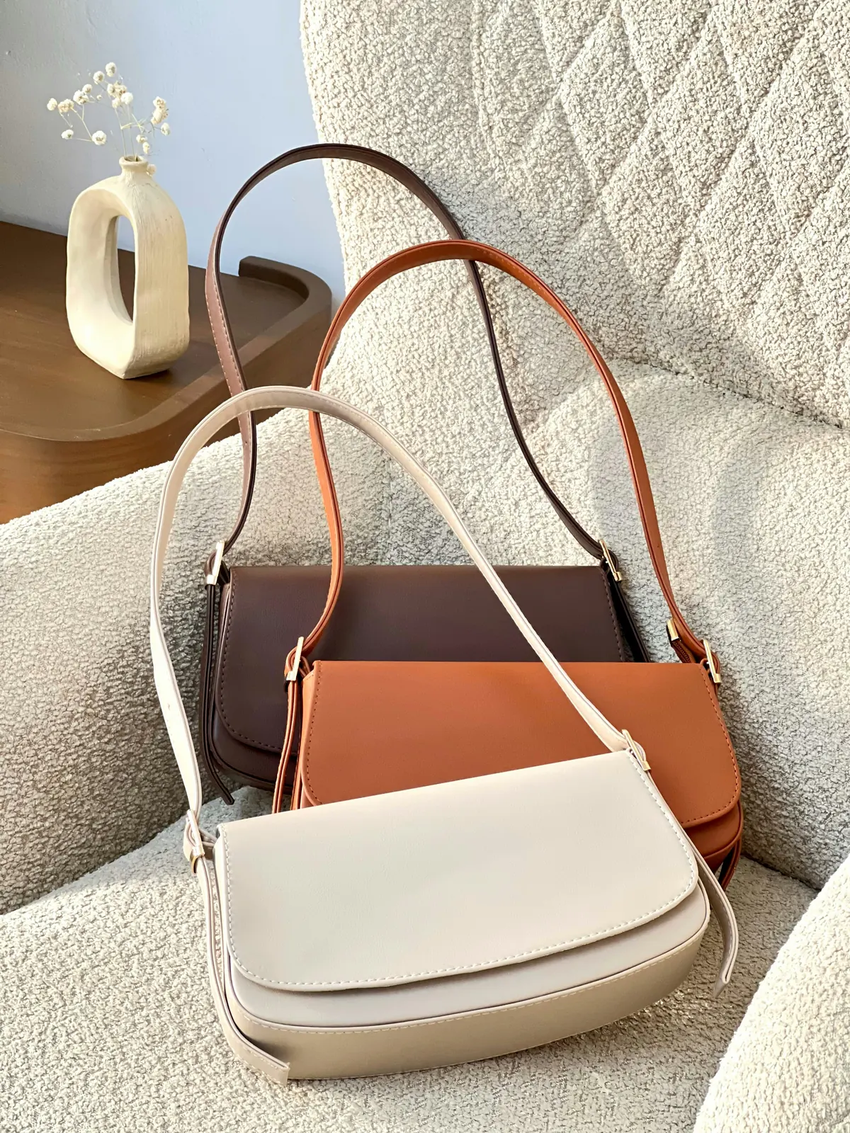 How to Remove Color Transfer from a Leather Bag FastThree leather bags in different colors showing light cream bag most vulnerable to color transfer stains from denim and dark fabrics requiring fast treatment