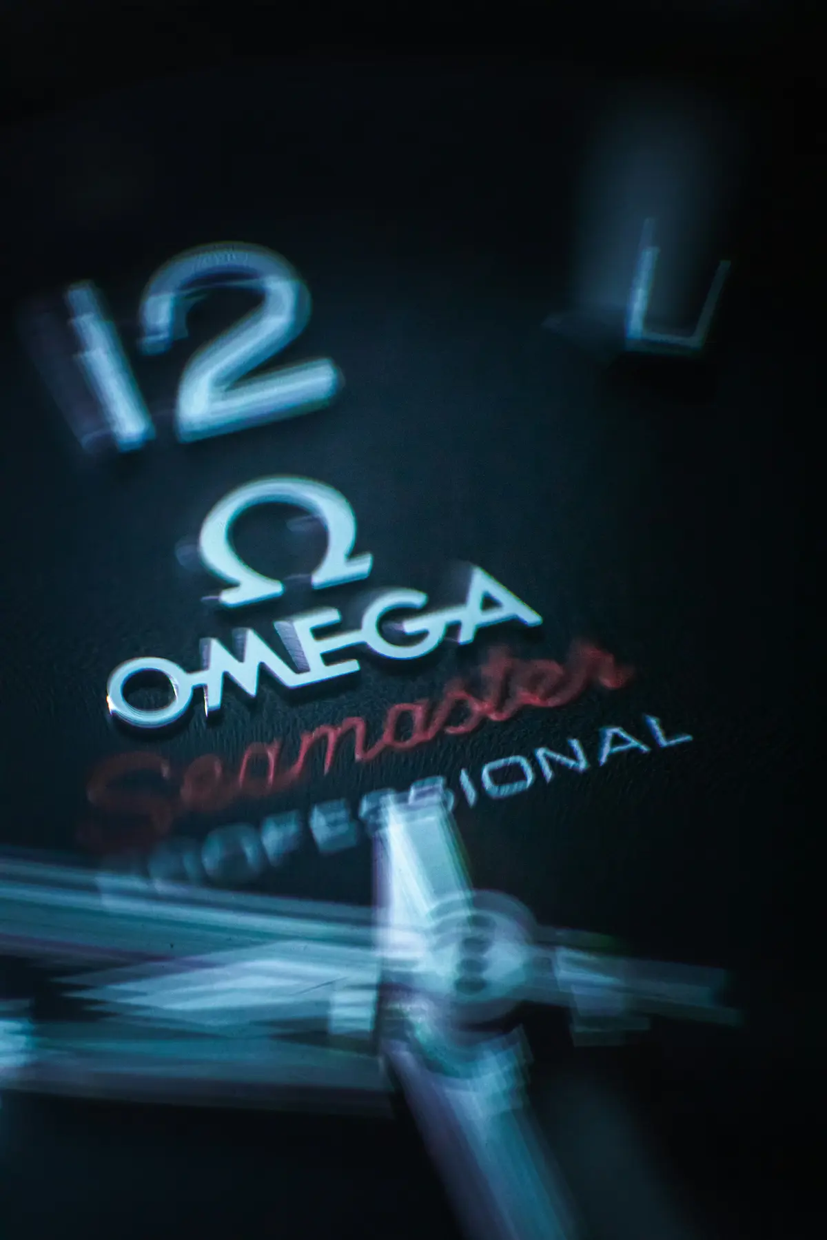 Close-up of an Omega Seamaster watch dial with dark moody lighting