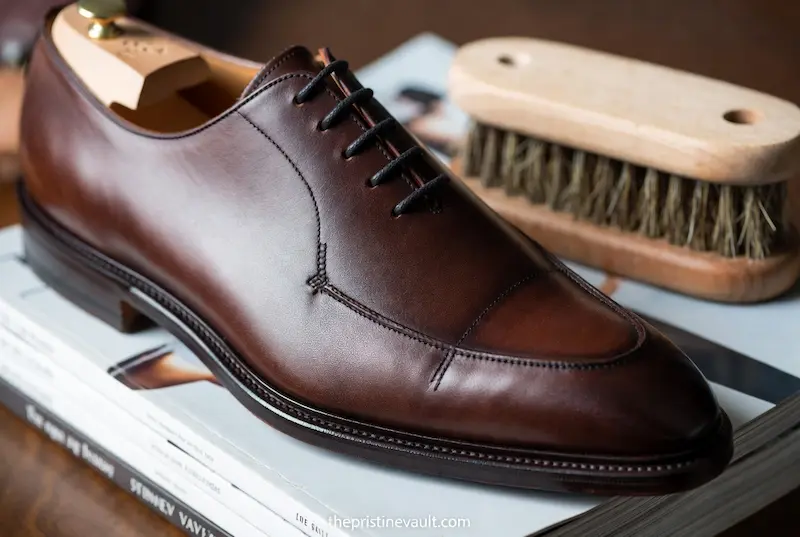 Close-up detail of high-quality hand-stitched leather on a premium logo-free men's dress shoe.