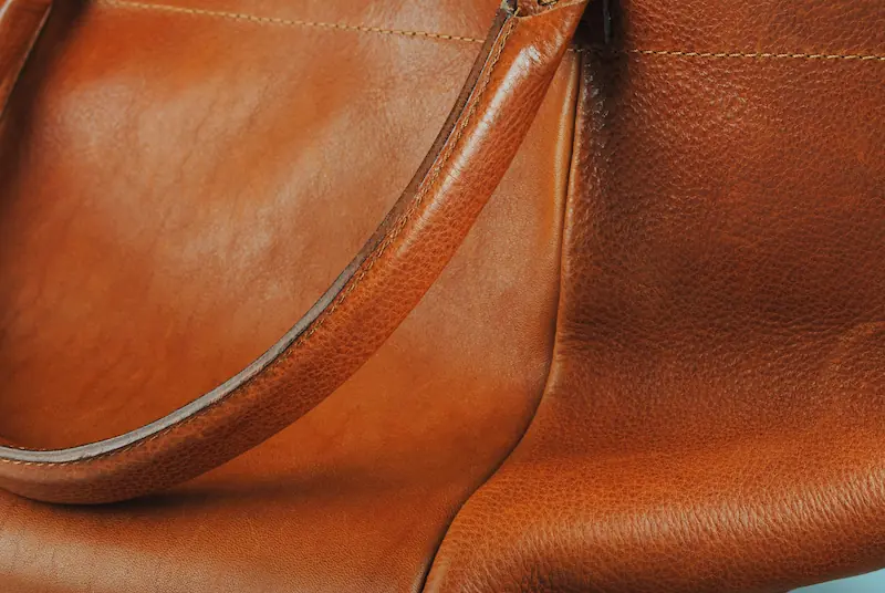 Vachetta leather bag texture close up natural patina care