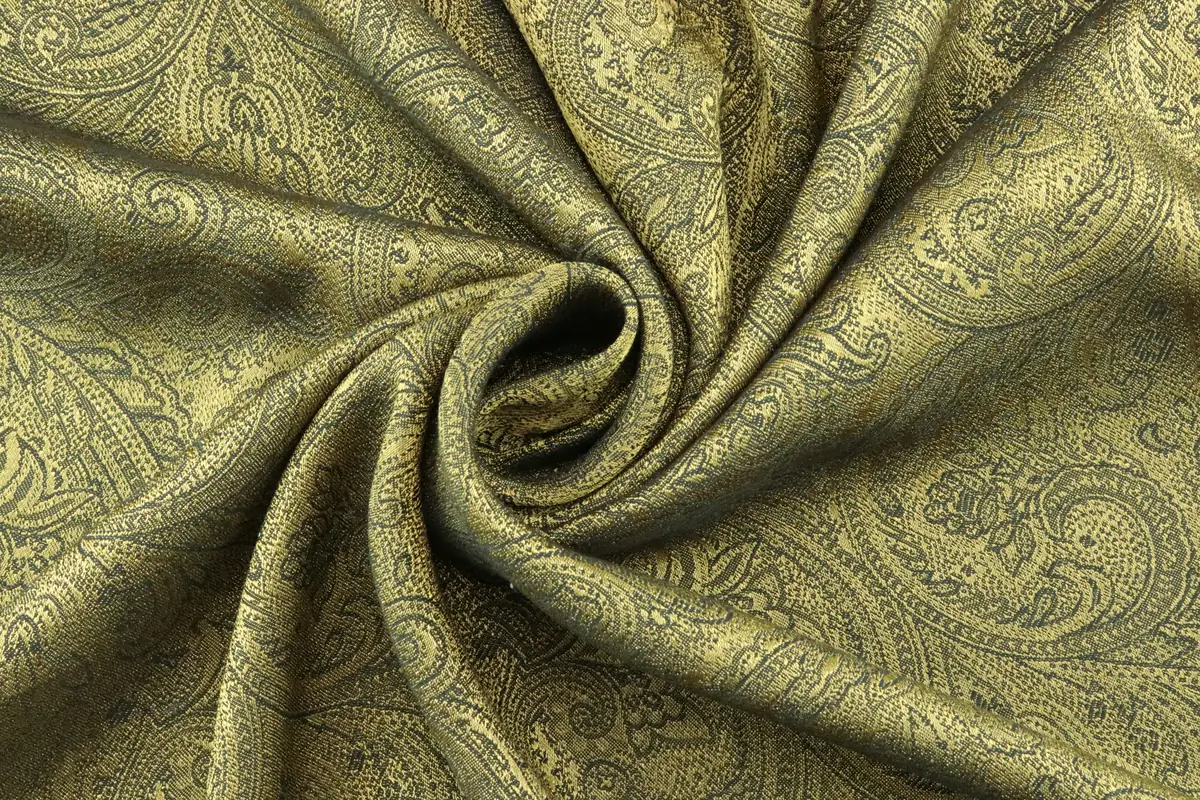 Luxurious silk scarf with intricate paisley pattern, representing fine textile conservation and proper storage